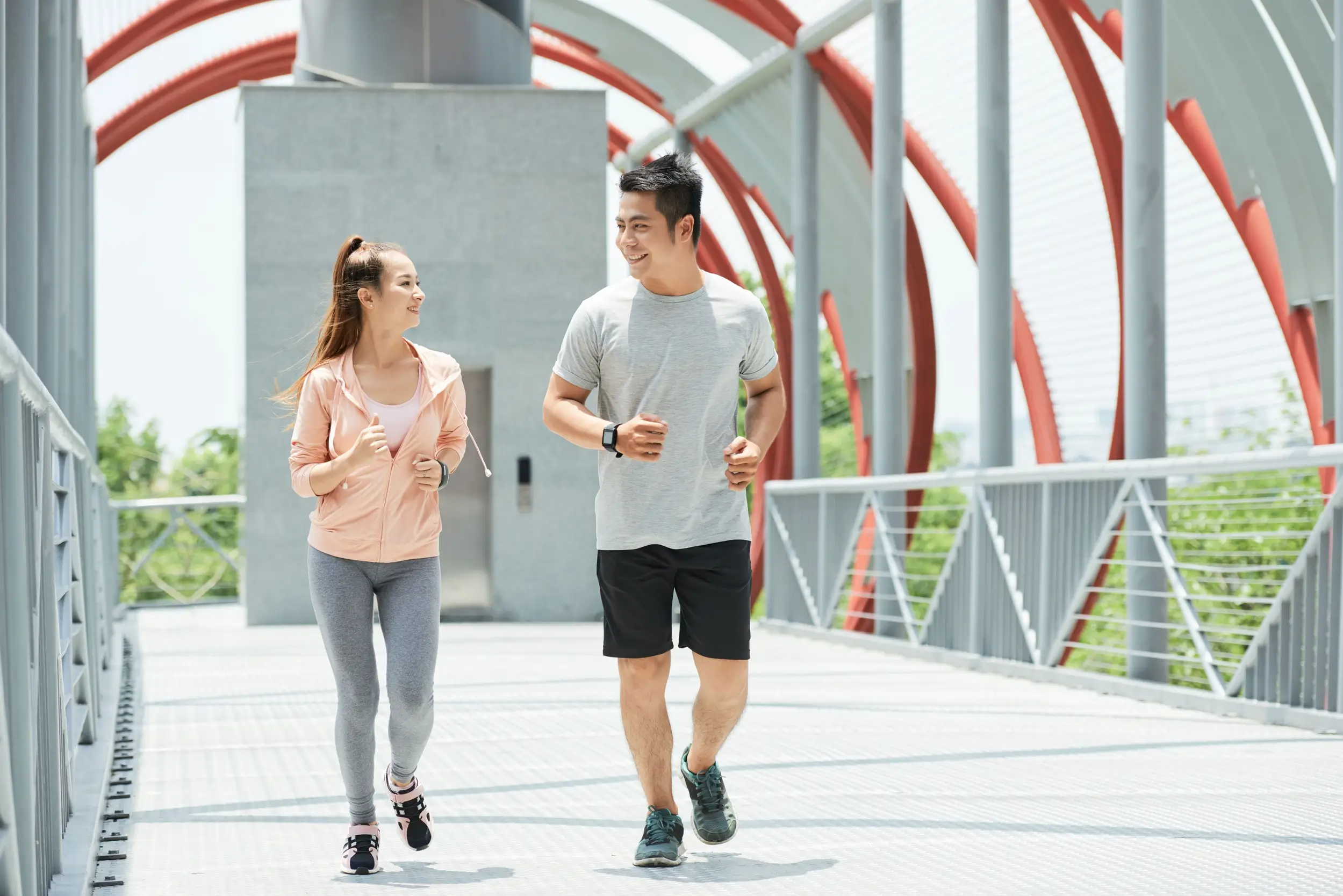 jogging couple at the birdge